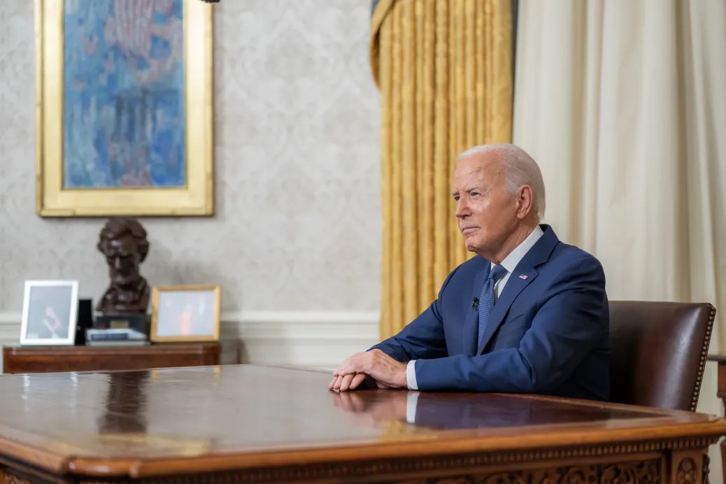 President Biden, at his desk after announcing his decision.