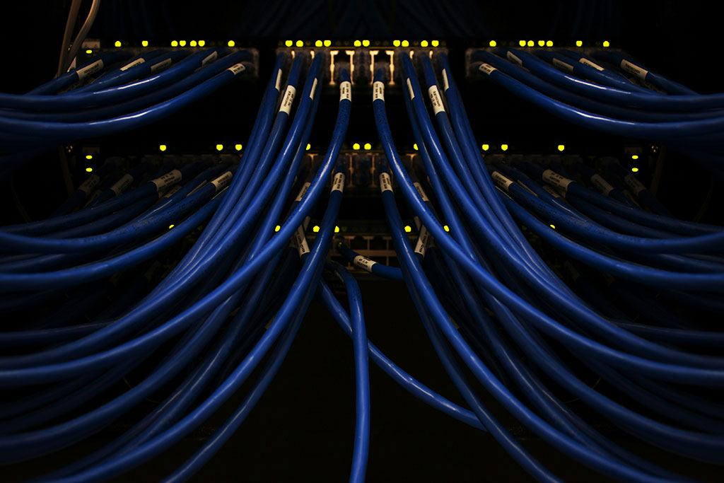 blue cables converge on a server.