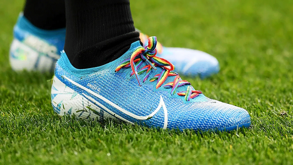 A football boot with rainbow laces