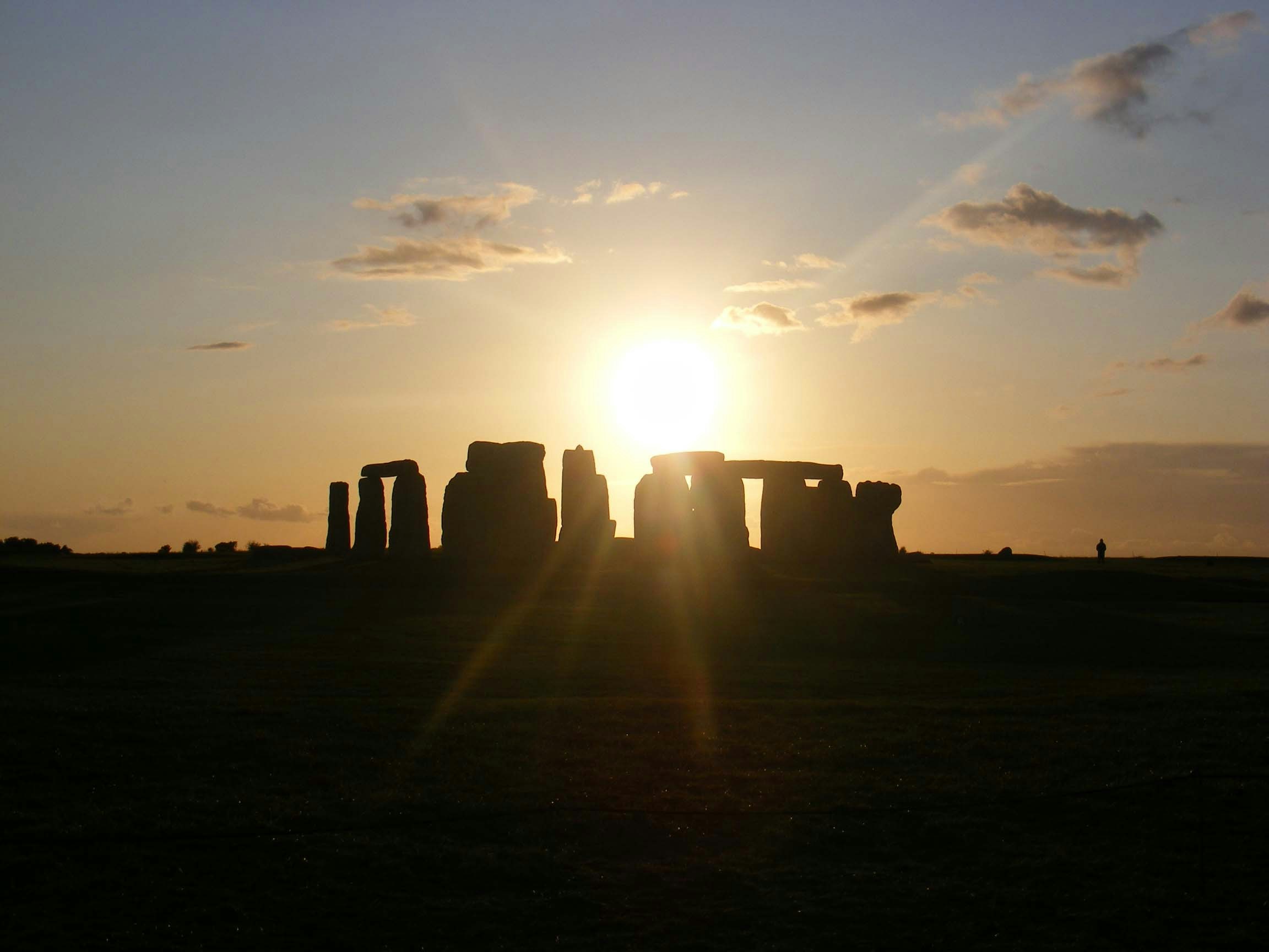 Sun rise casts a shadow over Stonehenge.