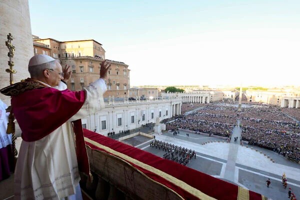 Pope Leo waves to the crowd.