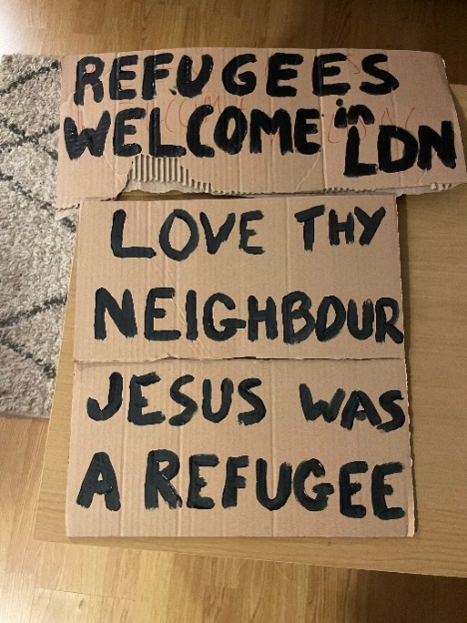 Protest signs written on cardboard.