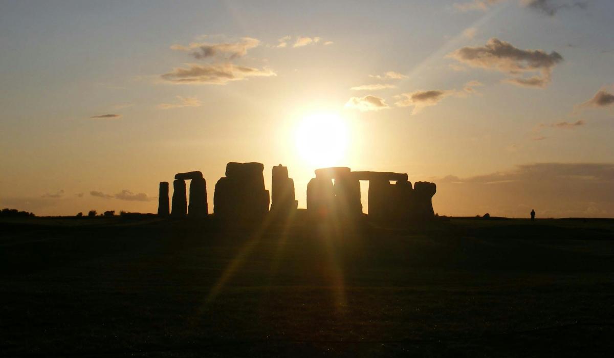 Sun rise casts a shadow over Stonehenge.