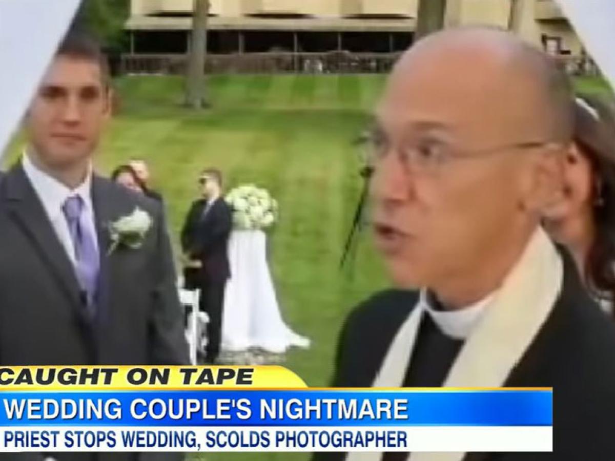 A screen grab of a news report; a priest looks angry turning away from a wedding couple. The caption reads: Wedding couple's nightmare. Priest stops wedding, scolds photographer