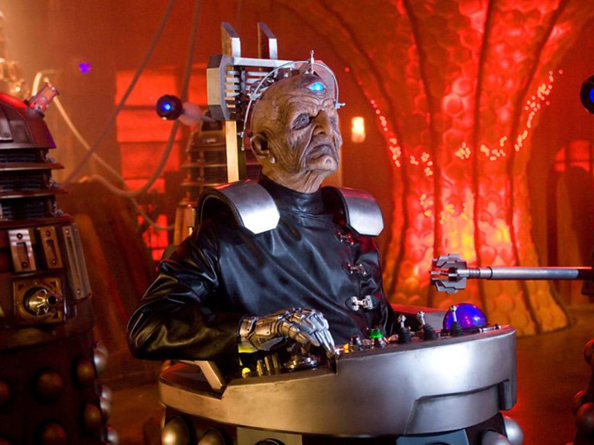 Davros, an alien leader sits in the lower half of a Dalek.