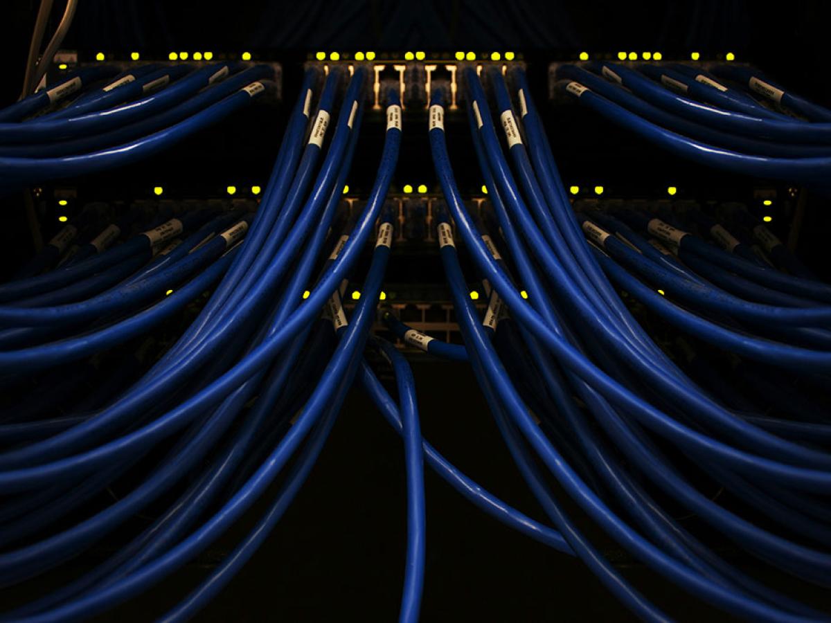 blue cables converge on a server.