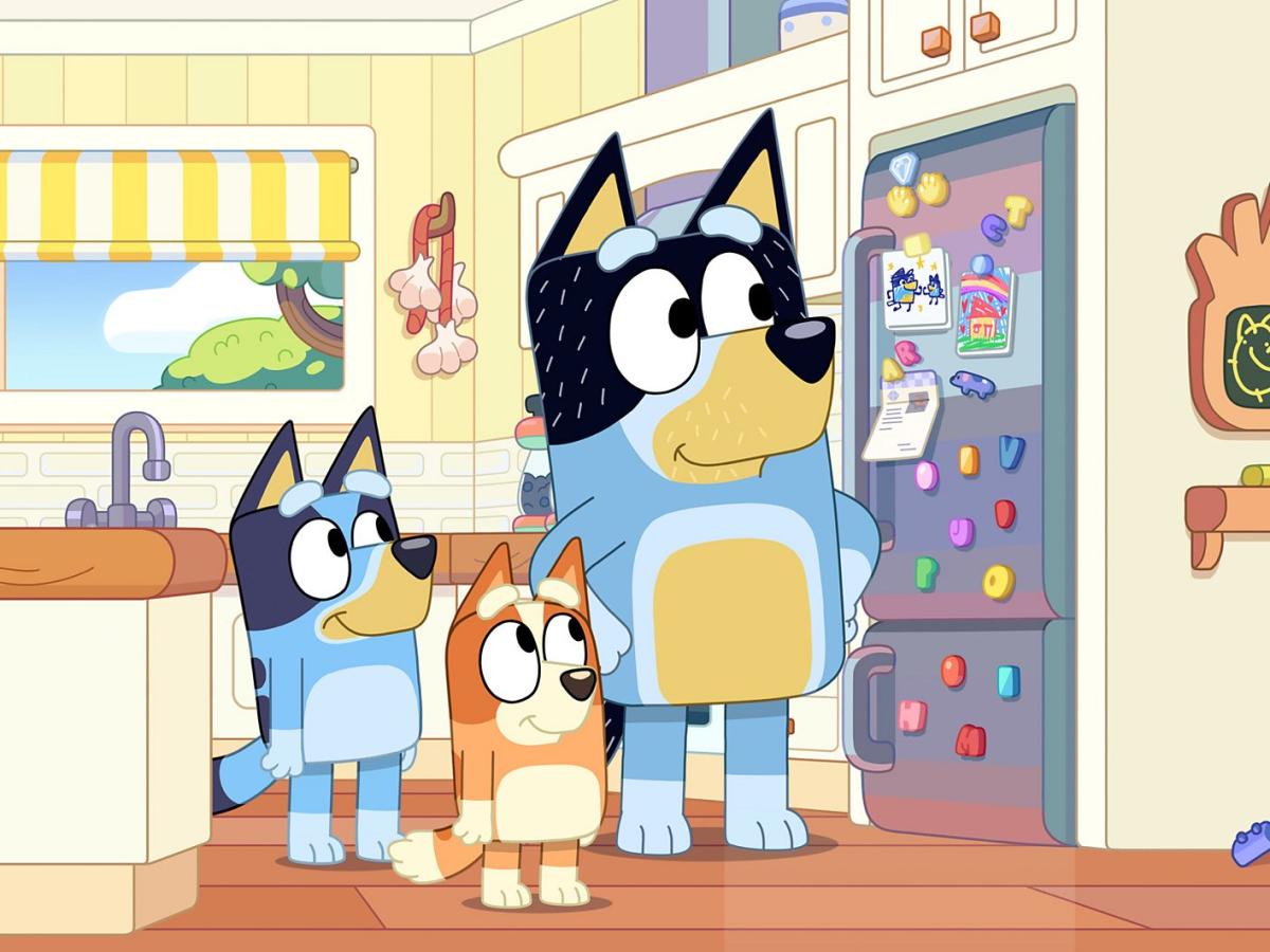 A cartoon dog family stand in their kitchen