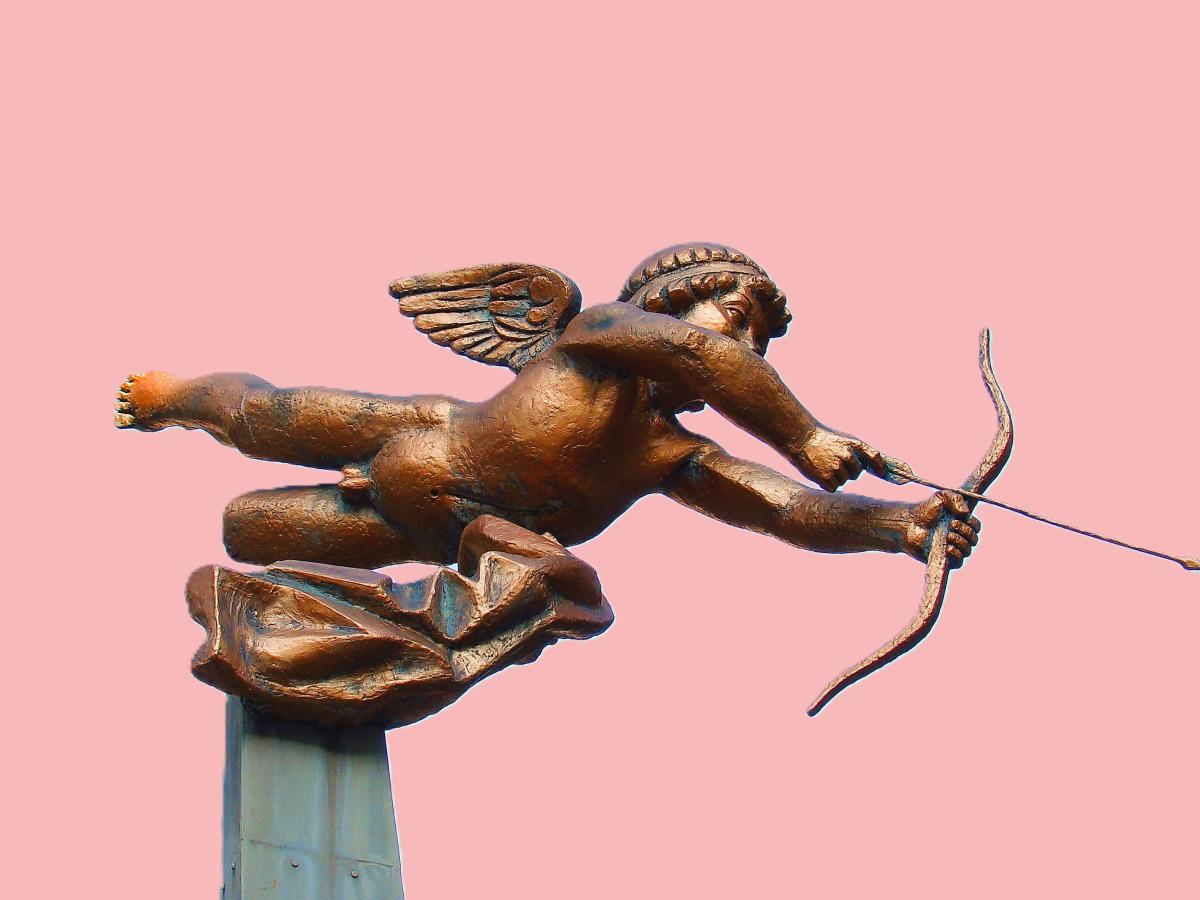 A cupid statue fires an arrow of love.