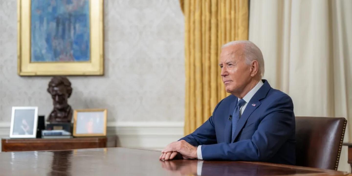 President Biden, at his desk after announcing his decision.