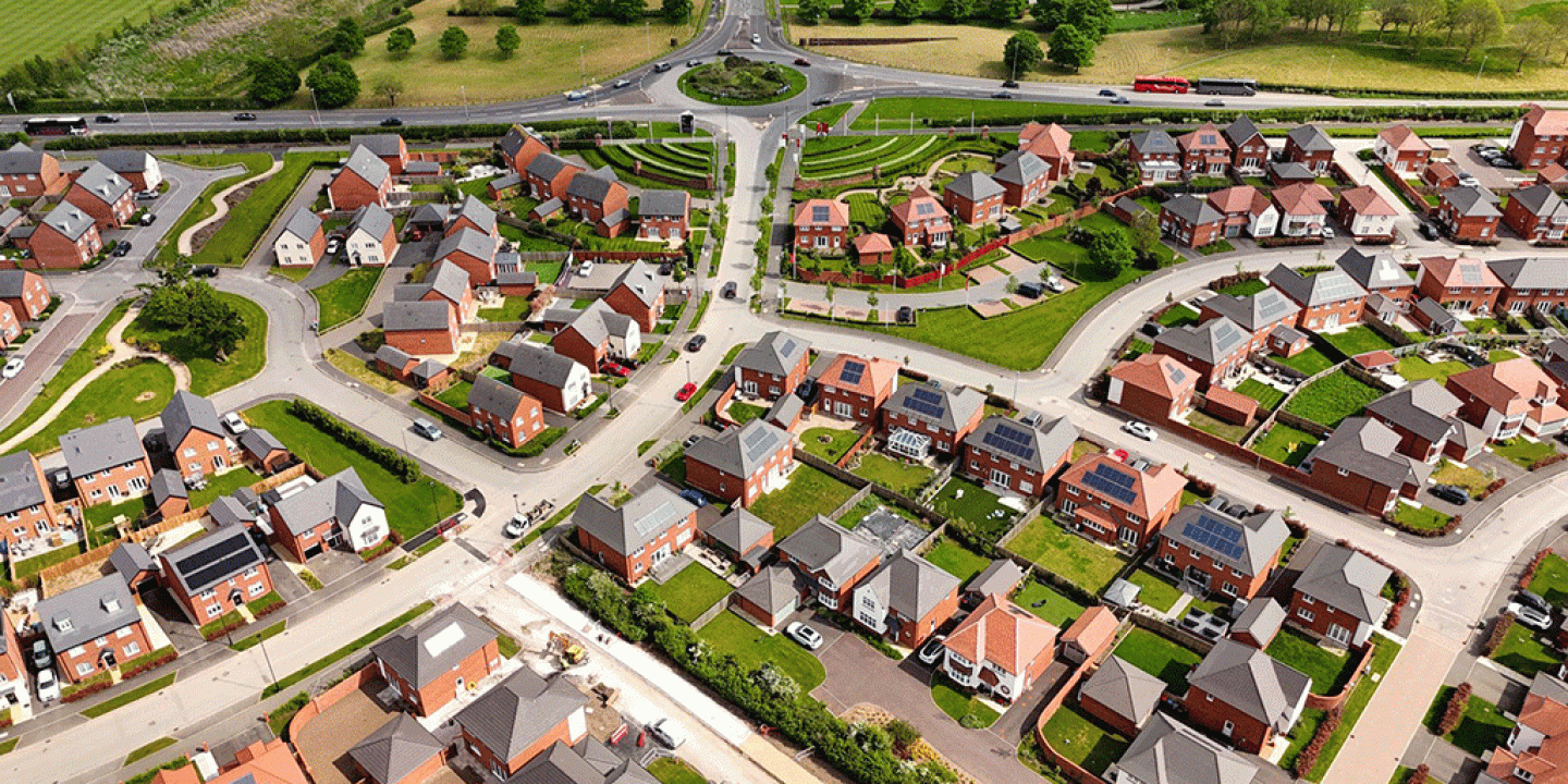 A CGI of a new housing estate viewed from above. 