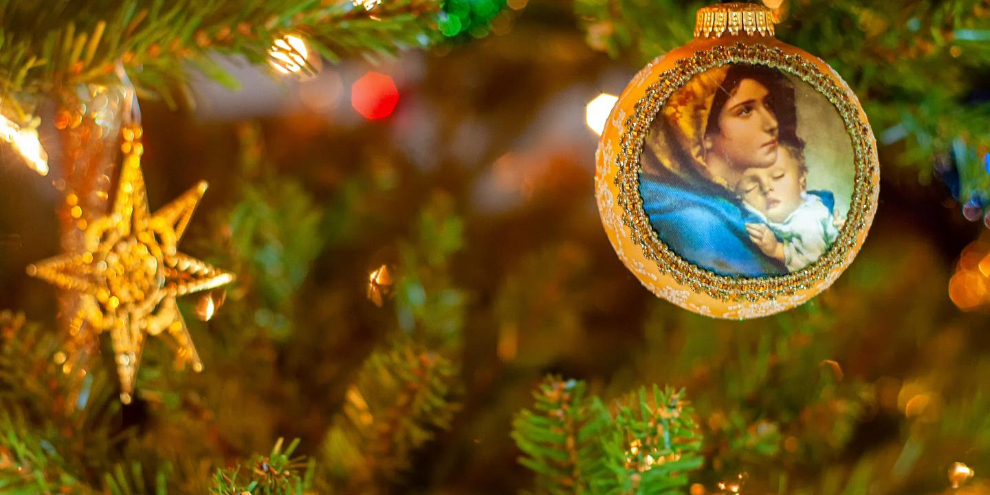 A Christmas tree bauble depicts the Virgin and Child.