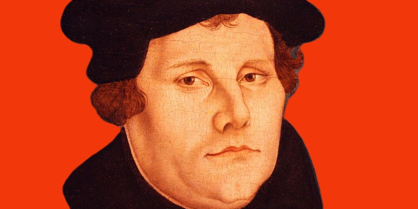 A head and shoulder painting of Martin Luther against a red background