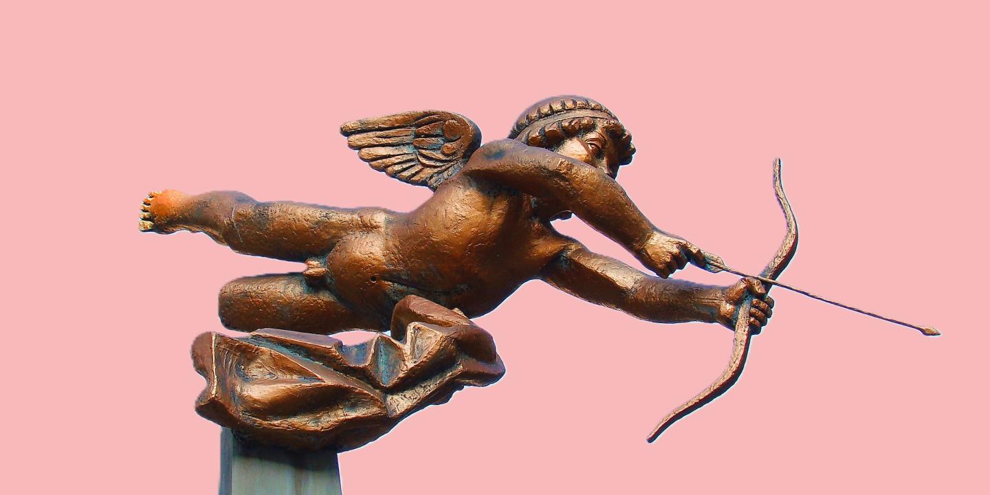 A cupid statue fires an arrow of love.