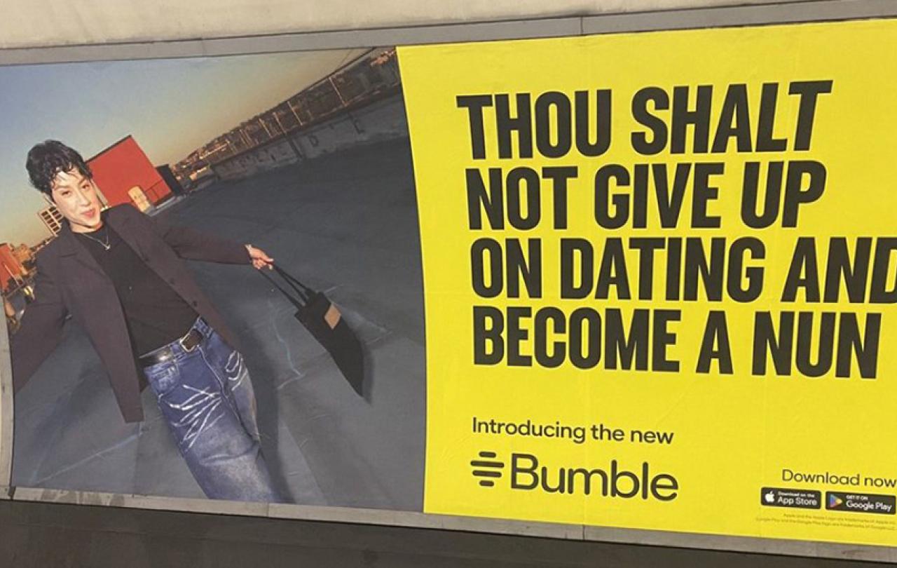 An advert on a Underground platform shows a person next to the slogna: Thou shalt not give up on dating and become a nun.