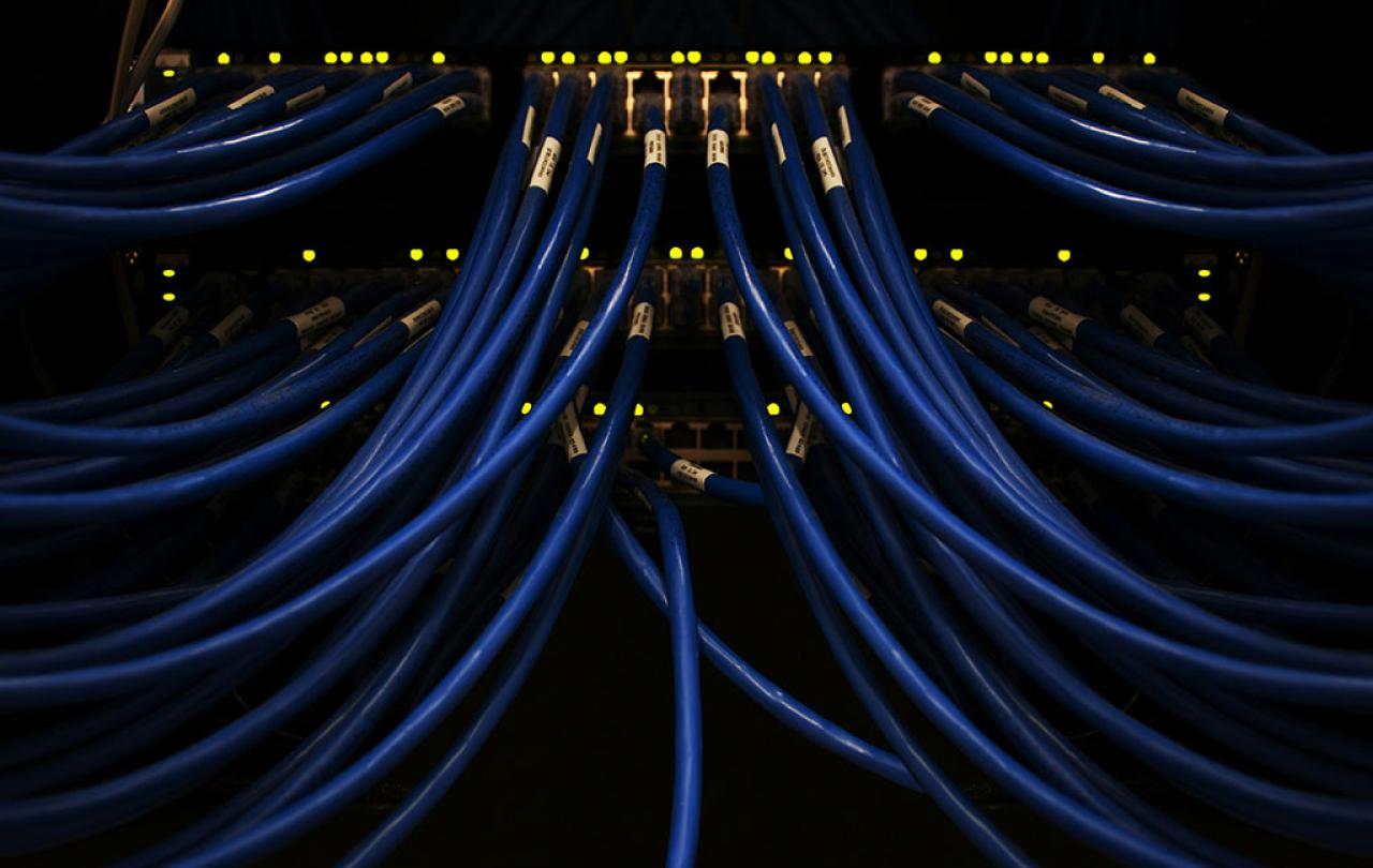 blue cables converge on a server.