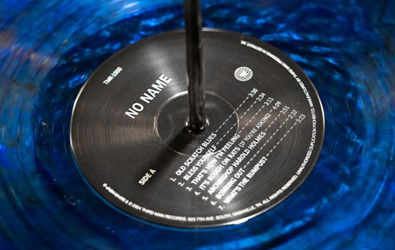 A close-up of the black label of a blue vinyl record