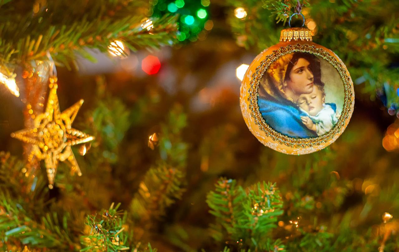 A Christmas tree bauble depicts the Virgin and Child.