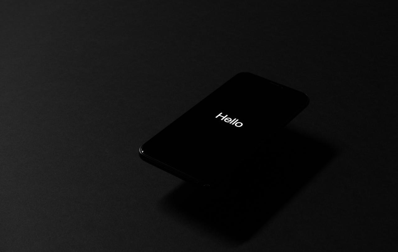 A dark image shows a dark screen with the tiny word 'hello' on it.