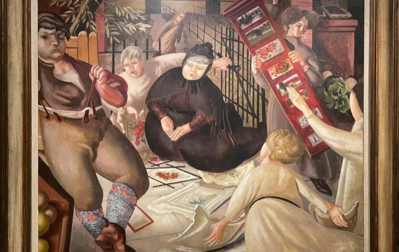 A woman dressed in dark Victorian clothes sits on a street among angels.