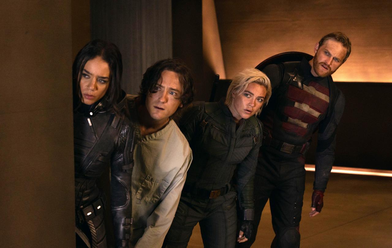 Four characters from a film loop warily to the side.