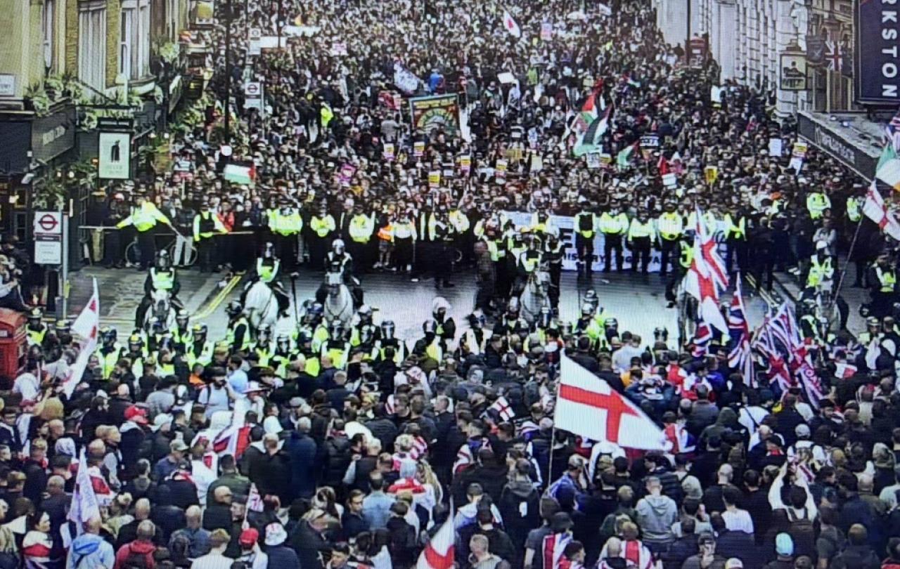 CCTV footage show two rival protests divided by a line of riot police.