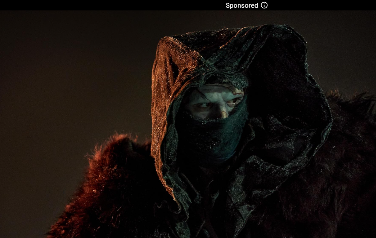 Frankstein stares our from his covered face.