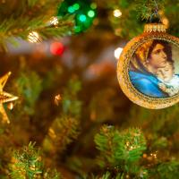 A Christmas tree bauble depicts the Virgin and Child.